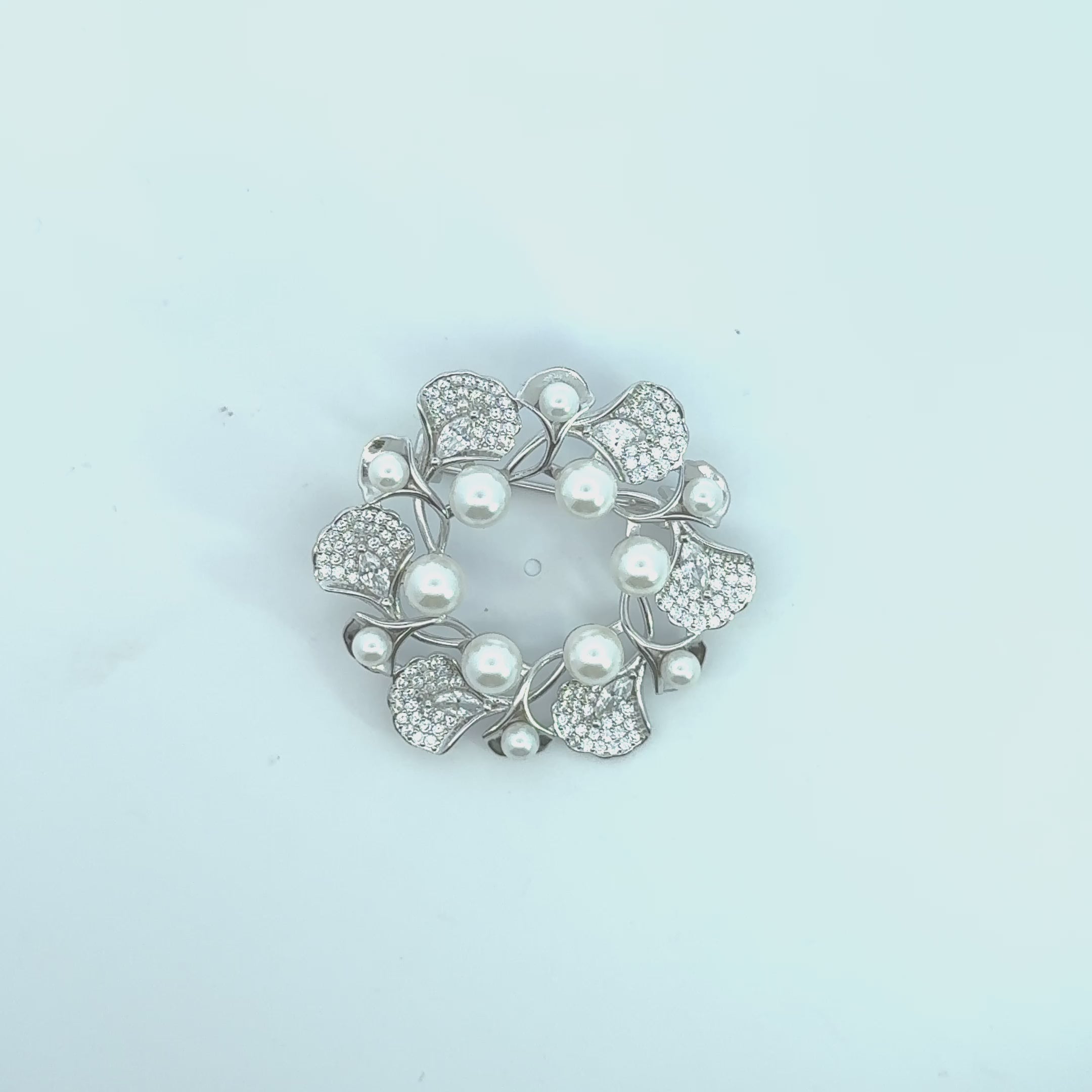Video of Ginkgo Leaf And Pearl Wreath Brooch Silver, showing the design, finish and movement from multiple angles.