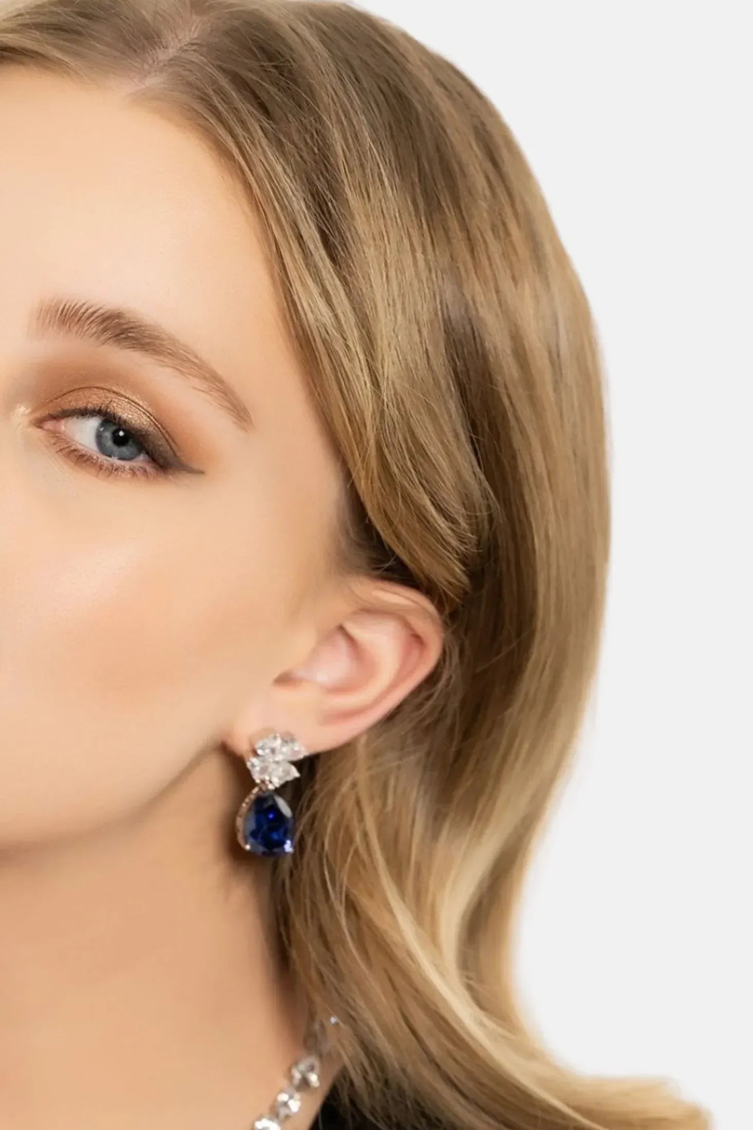The earring worn by a model.