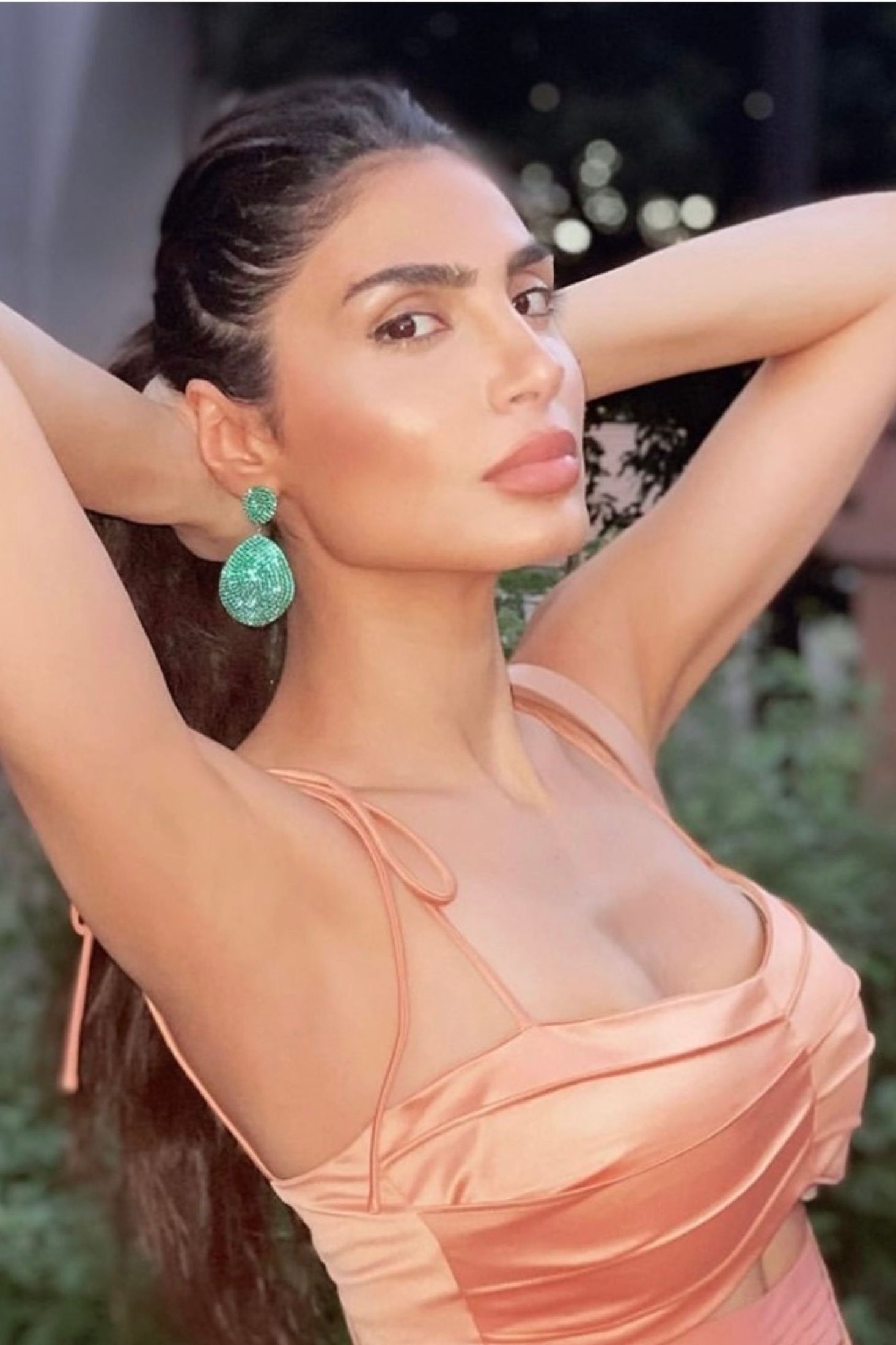 The earring worn by a model.