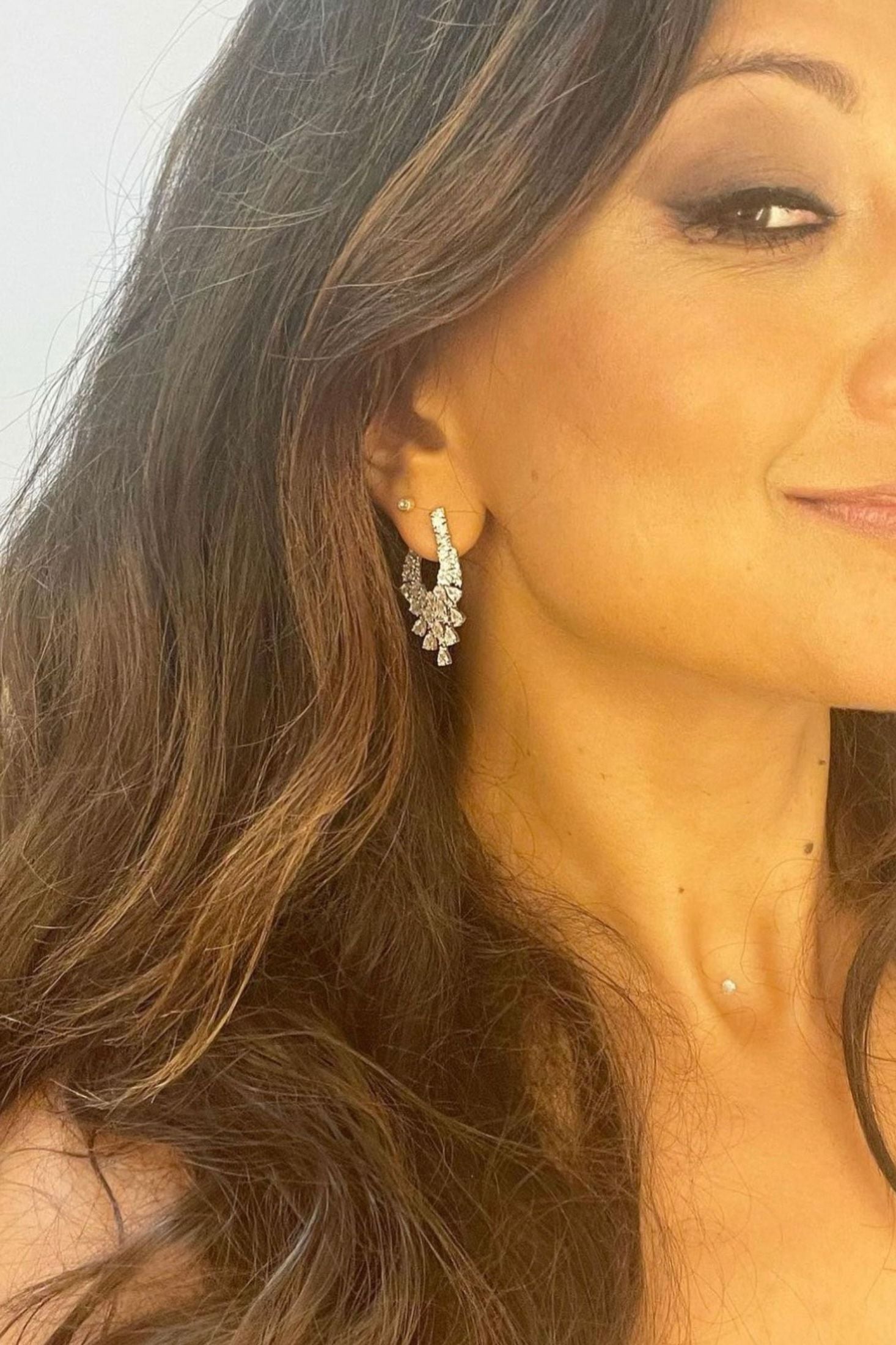 The earring worn by a model.