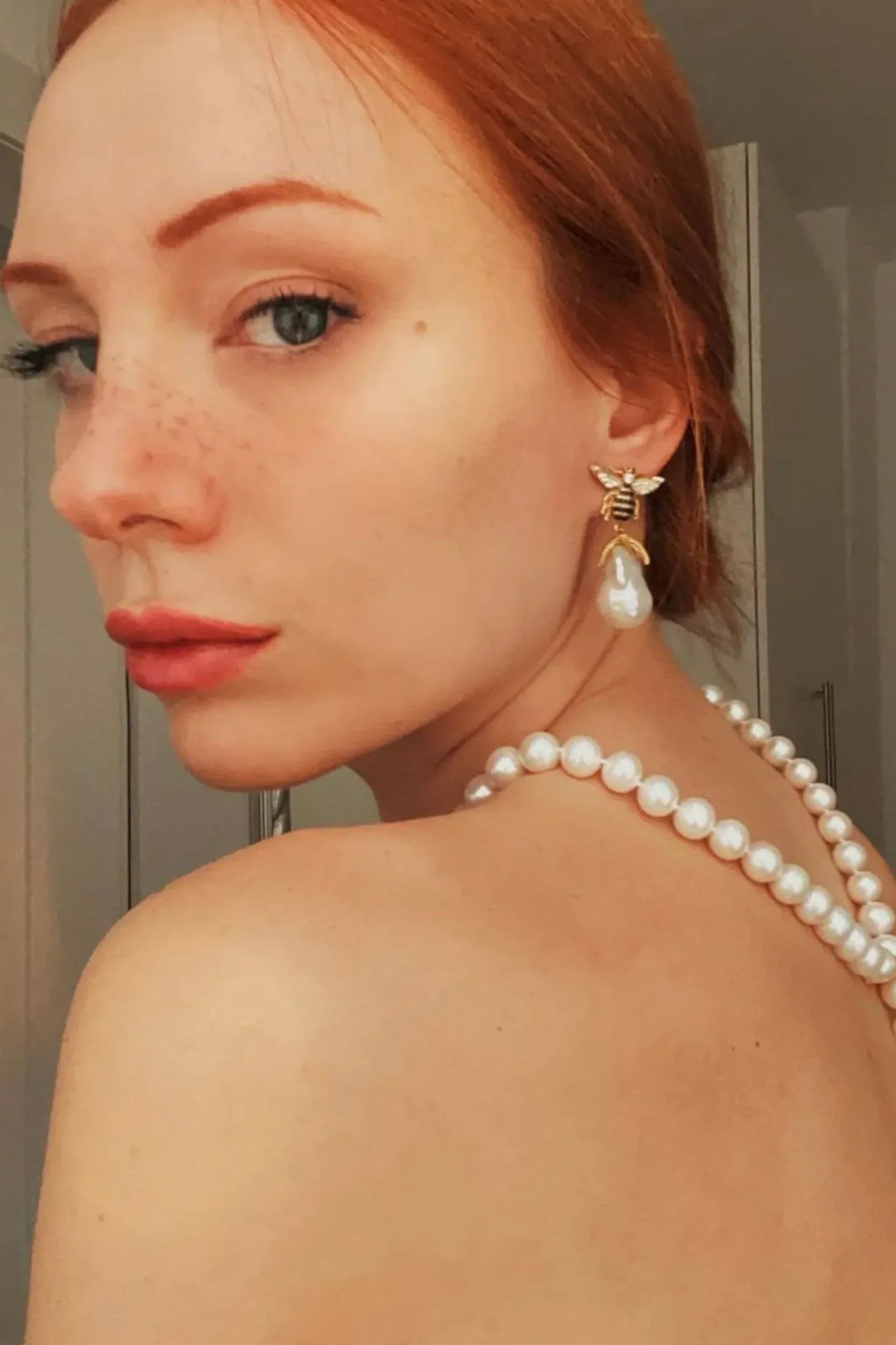 The earring worn by a model.