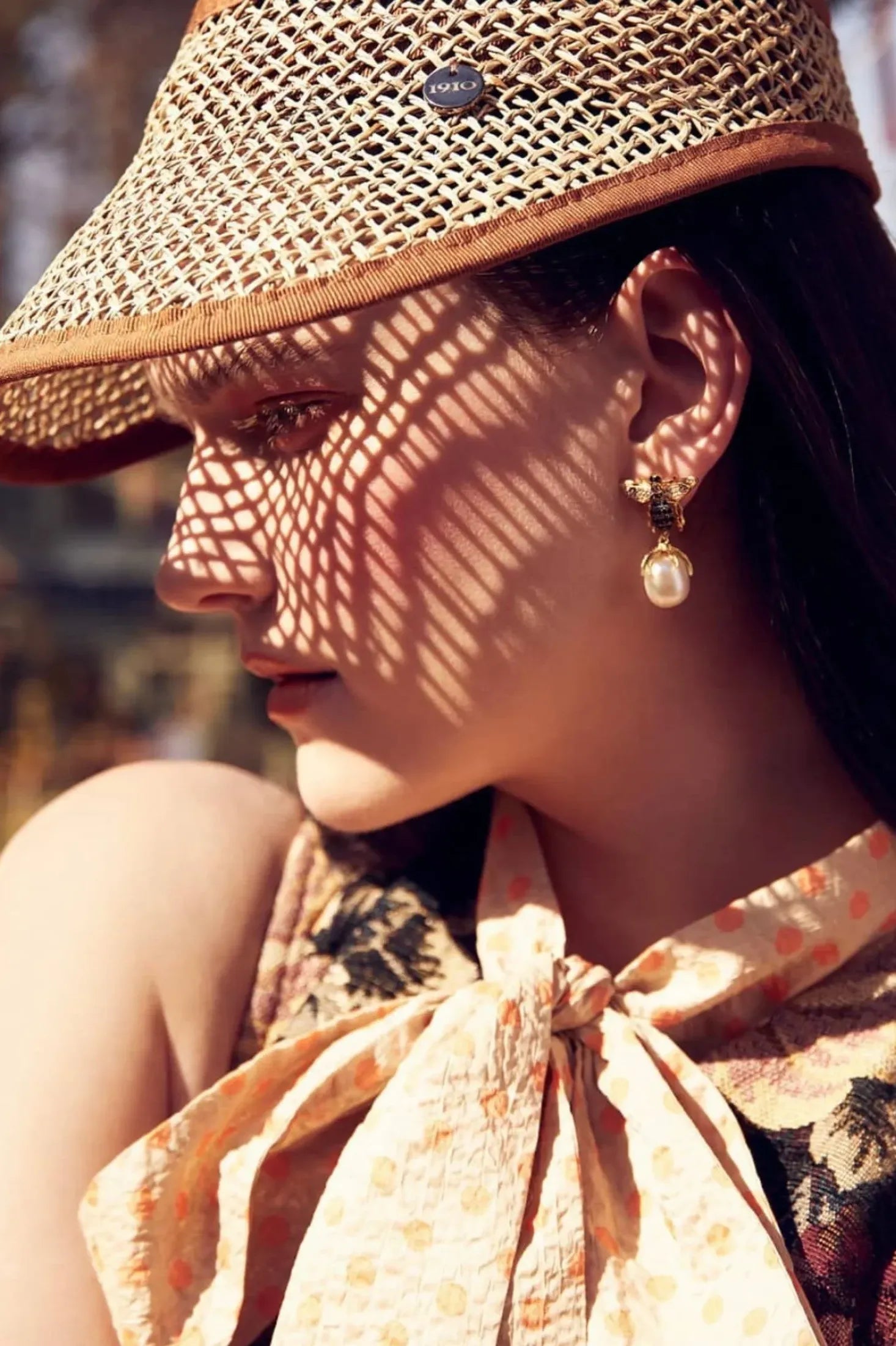 The earring worn by a model.