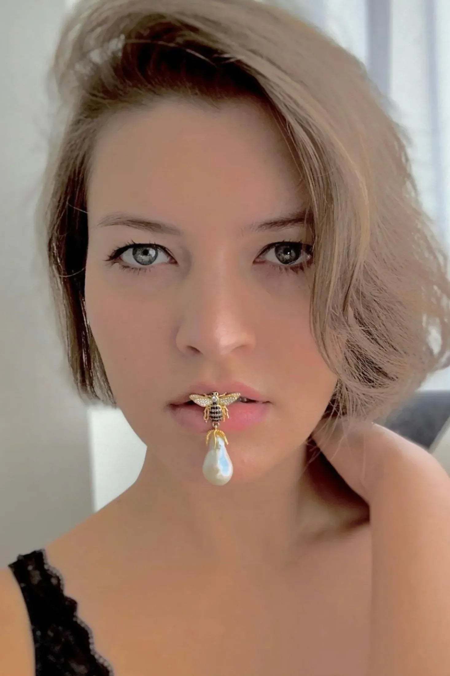 The earring worn by a model.