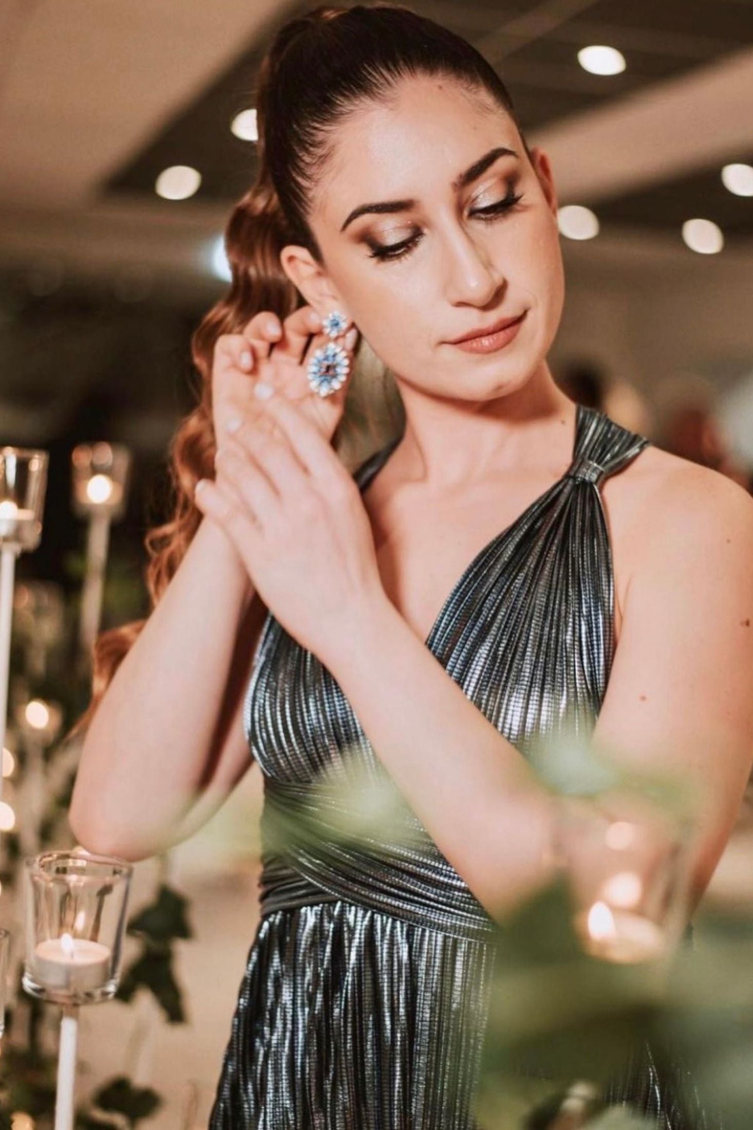 The earring worn by a model.