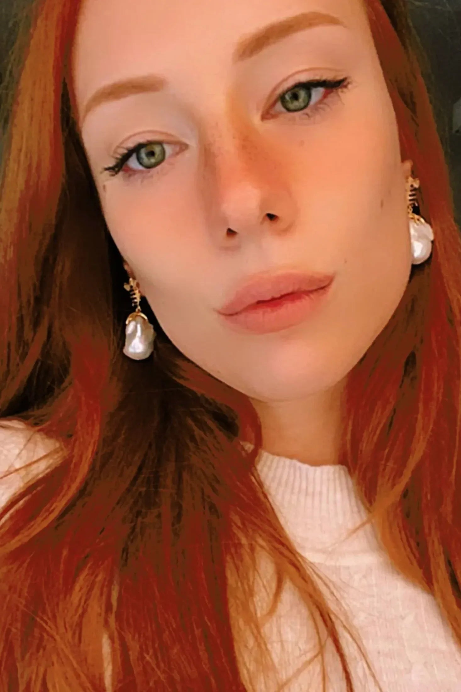 The earring worn by a model.