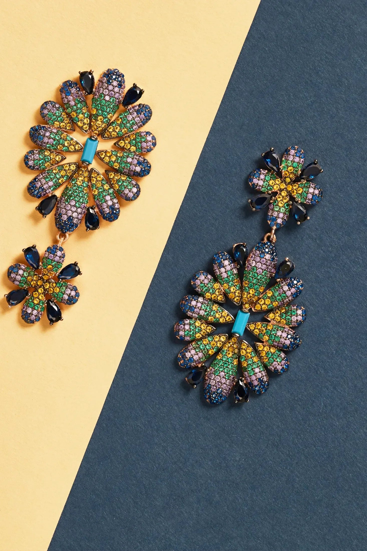 Babylon Multicoloured Flower Drop Earrings Gold worn by a model, showing how they sit on the ear and their scale.