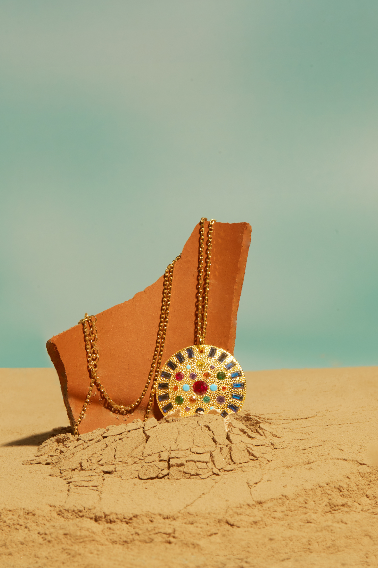 Ecliptic Mosaic Circle Gemstone Pendant Necklace Gold worn by a model, showing the pendant scale and how the chain sits.