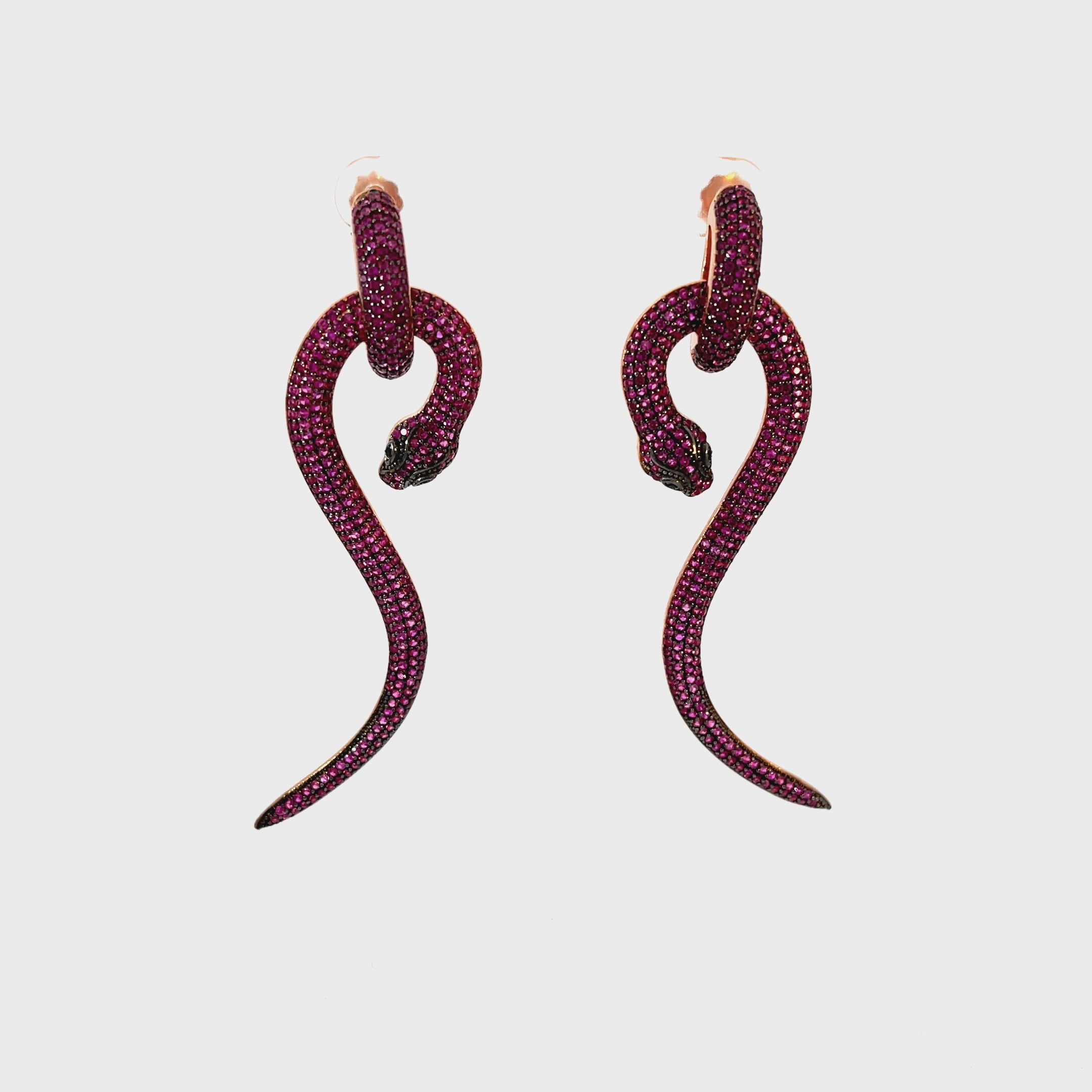 Video of Anaconda Snake Drop Earrings Rose Gold Ruby, showing the drop, movement and scale from multiple angles.